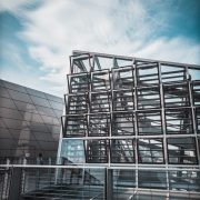 grey-concrete-building-with-multiple-windows_250224-252